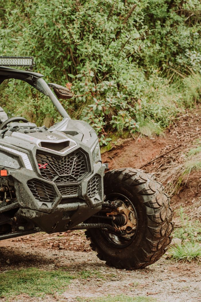 A detailed shot of a parked offroad 4x4 vehicle in a natural setting, ideal for adventure themes.